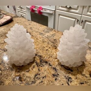 Set of decorative pinecone candles.